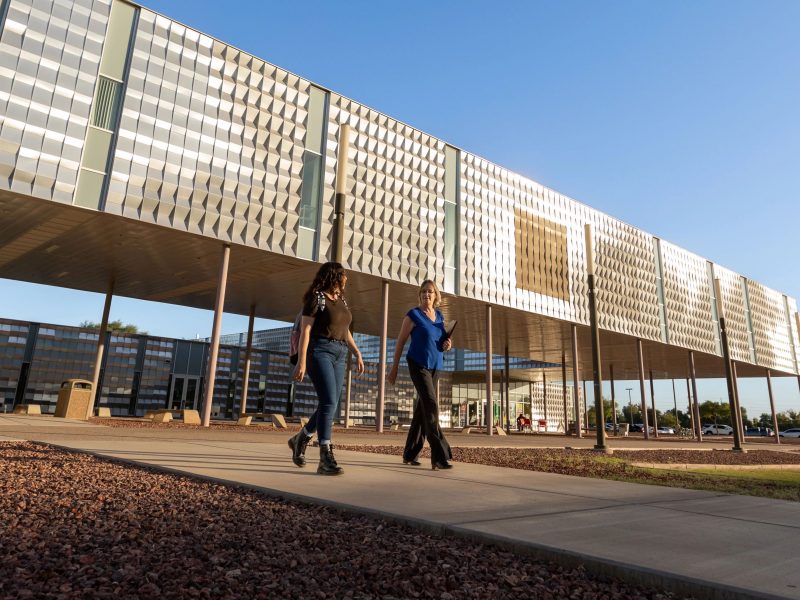 N A U&ndash;Yuma faculty walking on campus.