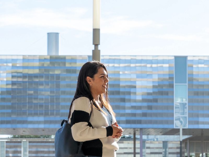 Students talking with an advisor outside at the N A U&ndash;Yuma campus.