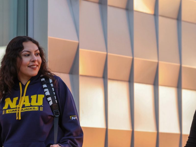 Students walking and talking on the N A U&ndash;Yuma campus.