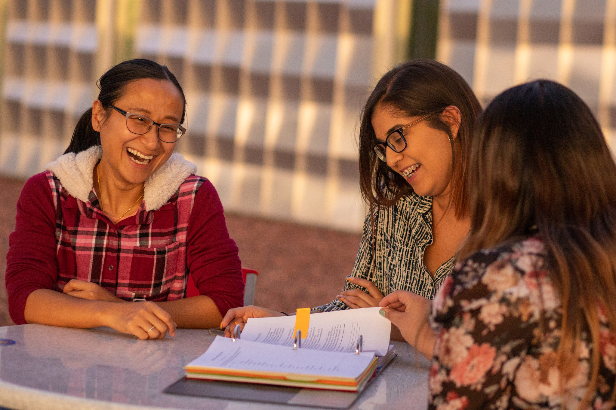 Students working together outside on the N A U&ndash;Yuma campus.