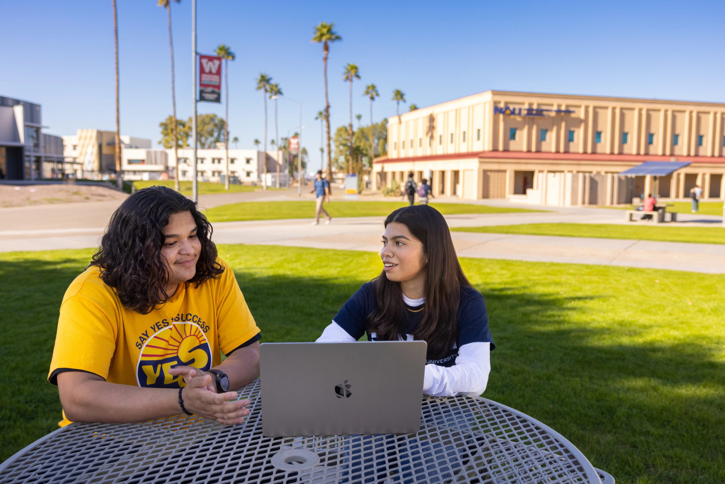 Students work together on the N A U campus.