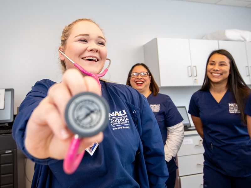 Students smiling in classroom.