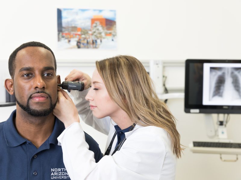 Student performing evaluation on patient.