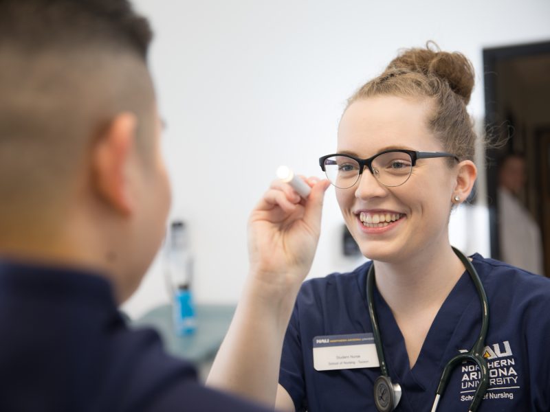 Nursing student observing patient.