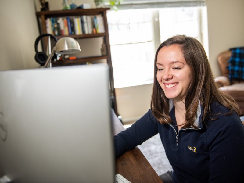 Student working on laptop.