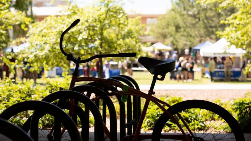 The silhouette of a bicycle on a sunny orientation day at N A U.