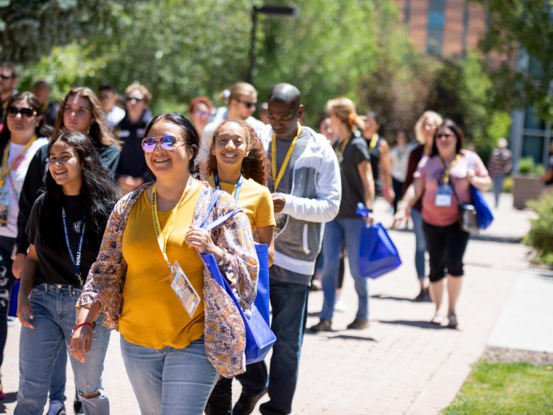 Freshmen students walking on the ped-way at N A U's Flagstaff campus for new student orientation.