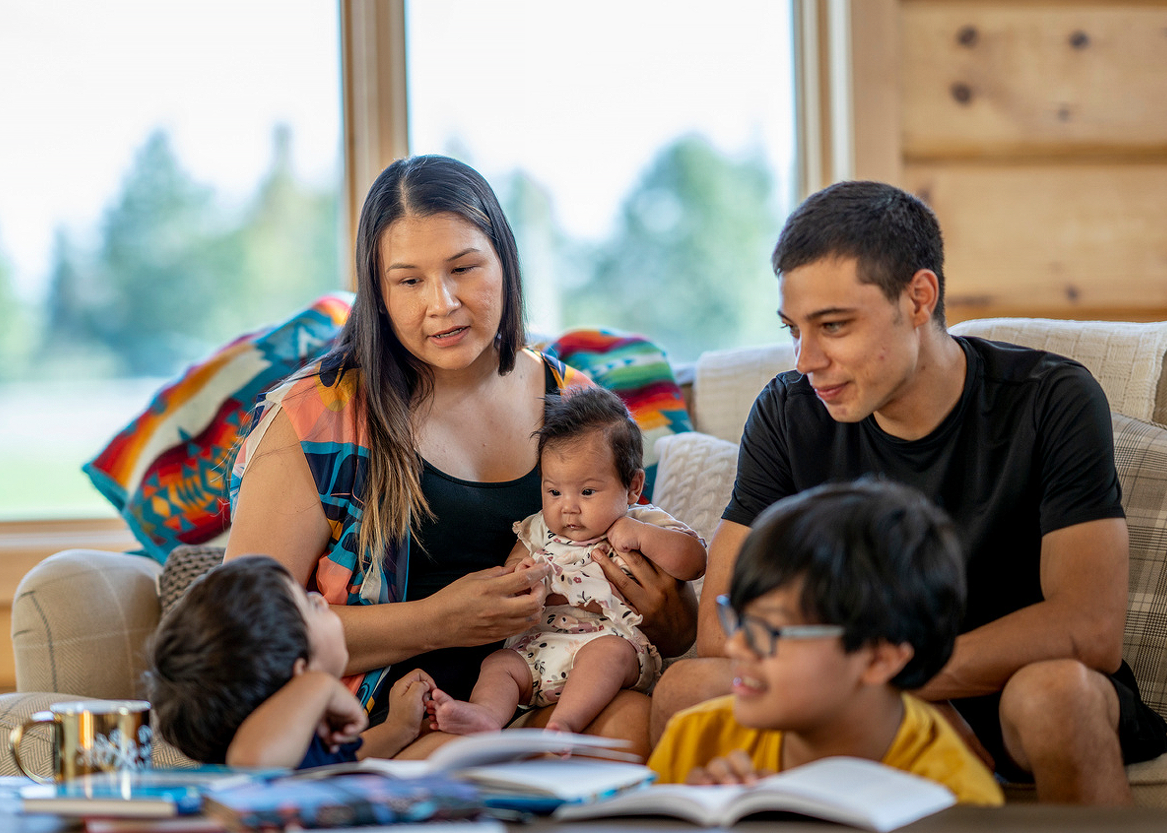 A family plays with their children