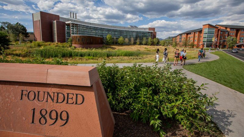 Students walk by the Applied Research and Development building on N A U's Flagstaff campus.