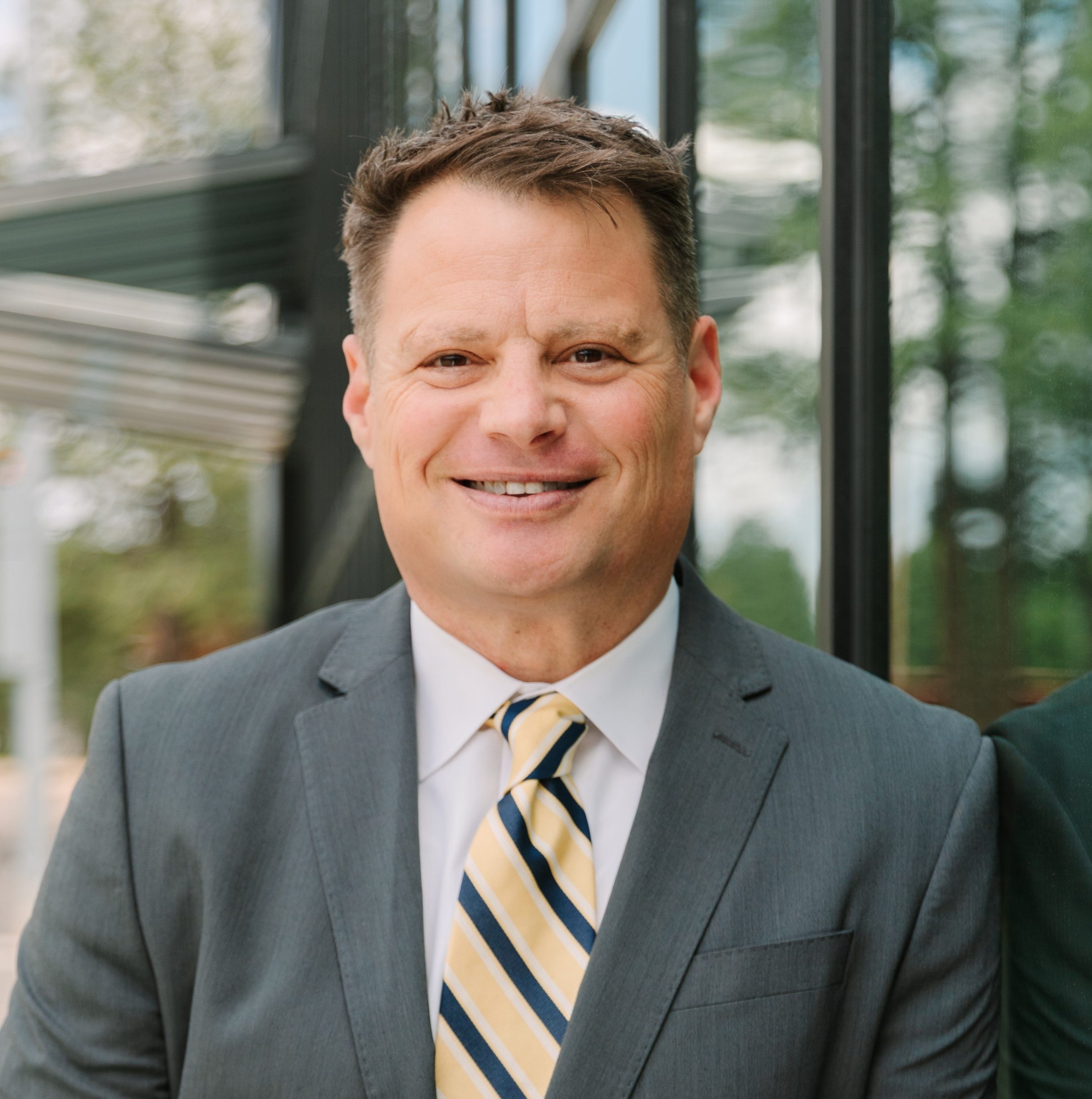 Uri Farkas smiling for a headshot photoshoot.
