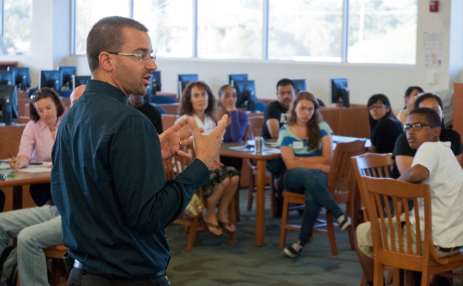 Chad Gestson, NAU alumnus and 2013 Rodel Exemplary Principal, speaks with students and their parents
