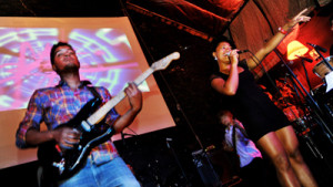 Avianna Acid singing with band