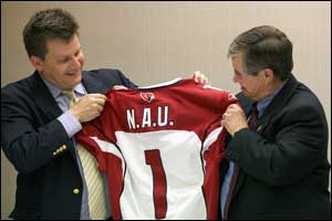 Micheal Bidwill giving John Haeger a Cardinals' jersey