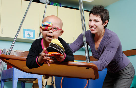 Occupational therapist works with a patient.