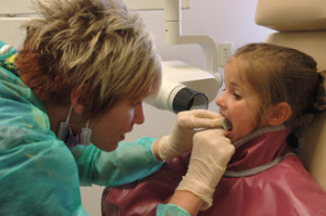 Dental hygiene student with a patient.