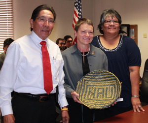 President Rita Cheng showcases NAU woven basket at Tribal Council