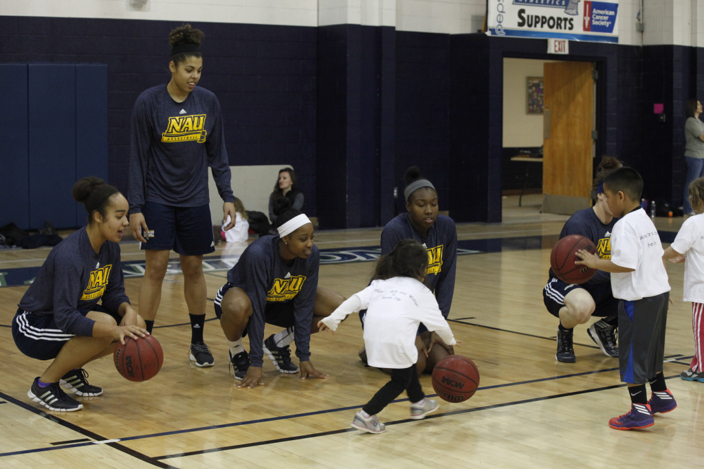 Women's basketball teaches children