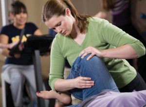Physical Therapy student trains on a patient