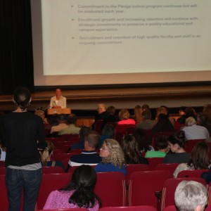 Cheng hosts the forum and responds to questions