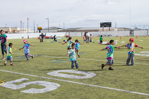 kids spin and play on the field