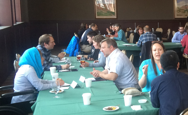 Researchers engage in discussion.