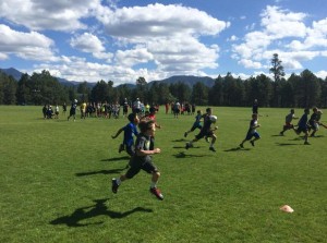 the kids race down the field