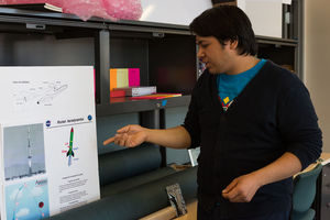 Robert Castellanos shows off his posterboard on aerodynamics