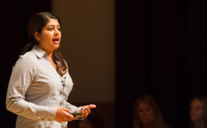 grad student Uzma Tahir gives a speech