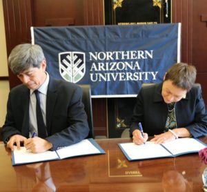 NAU President Rita Cheng signs a memorandum of understanding next to CETYS President Fernando León García