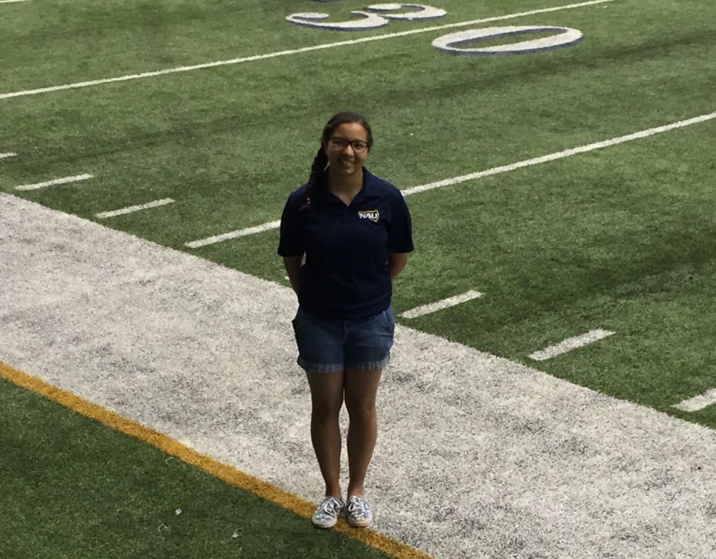 Lanae Blocker on the football field sideline