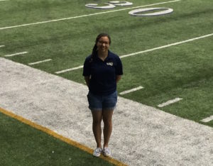 Lanae Blocker on the football field sideline
