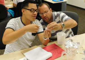 CSTL teacher works with student
