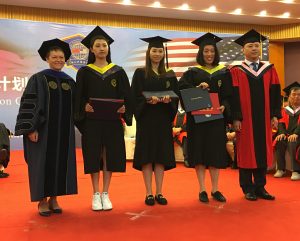 President Cheng poses with NAU 1+2+1 graduates