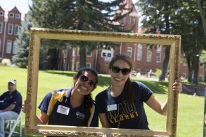 NAU alumni pose on north campus