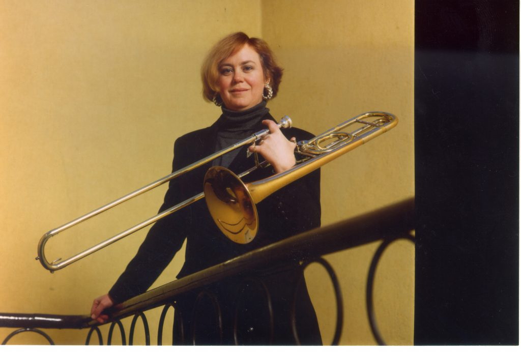 Conant poses with a trombone