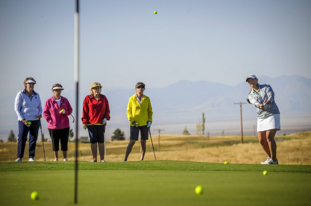 Women play golf