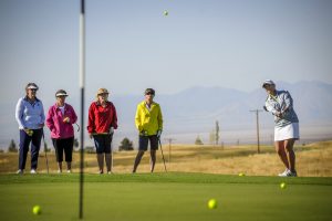 Women play golf