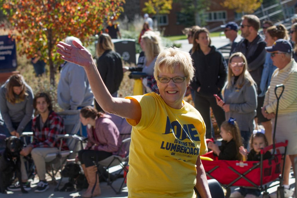 NAU Alumna waves