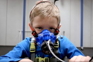 Boy wears exoskeleton