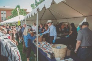 People are served food at BBQ