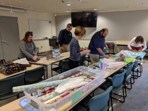 volunteers wrapping gifts