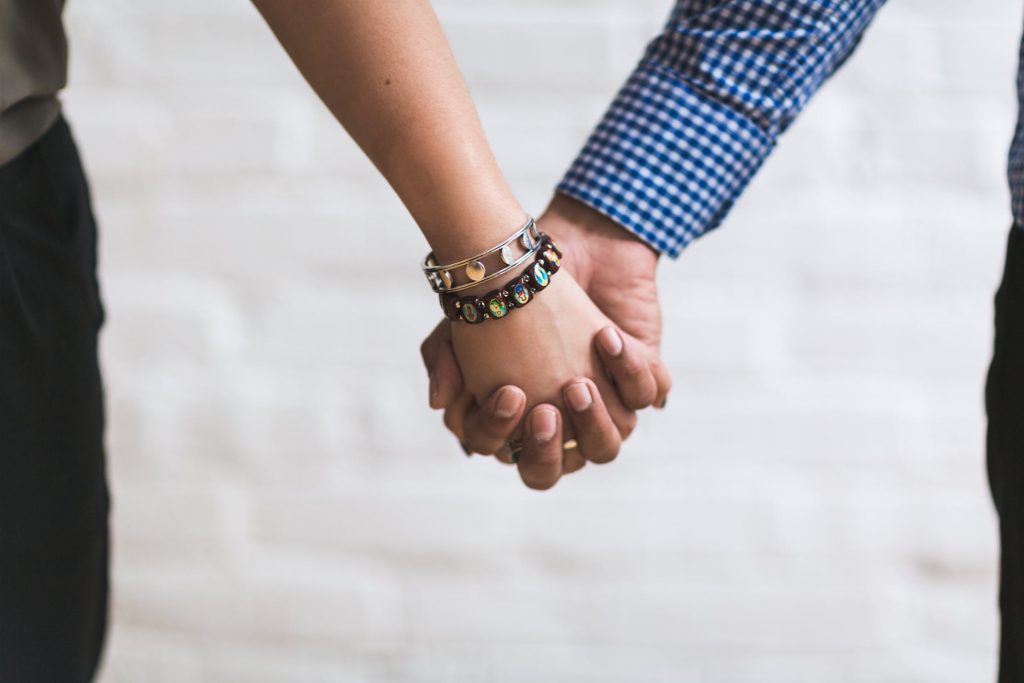 Couple holding hands