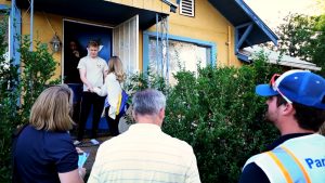 Volunteers greet neighbors