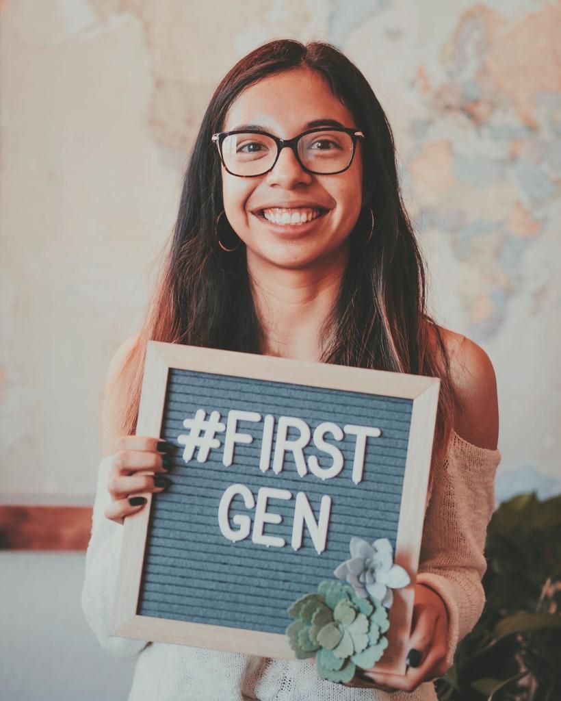Student holding sign