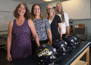 Four researchers stand together