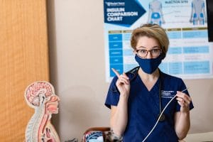 A nursing professor teaches in the classroom