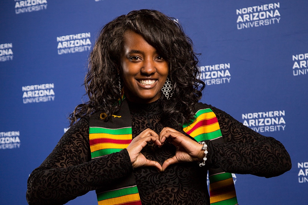 NAU student heart hands