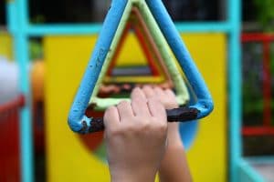 Students play on monkey bars