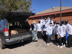 HRM students stand together while meals are picked up