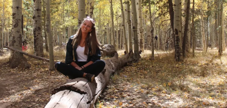 Tania Ferronato sits in the aspens